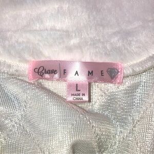 Very soft white womans vest. size large. pockets inside and outside. button up.